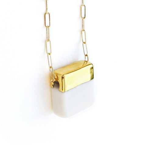 squared necklace on long chain